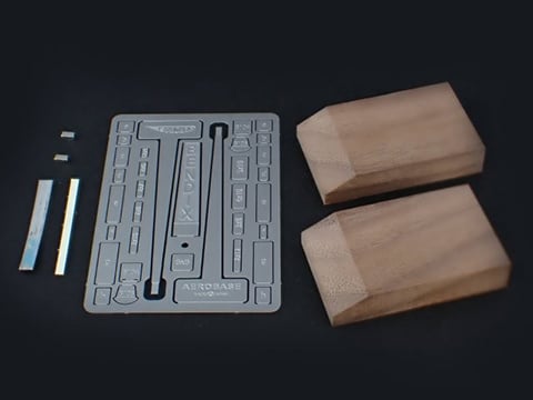 Contains walnut base, steel parts, magnet