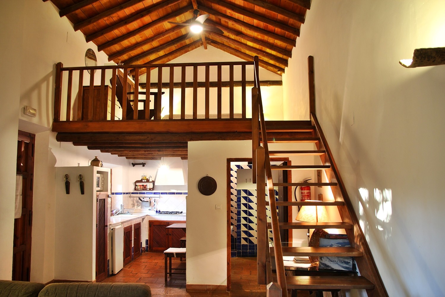 The living with the stairs to the bedroom