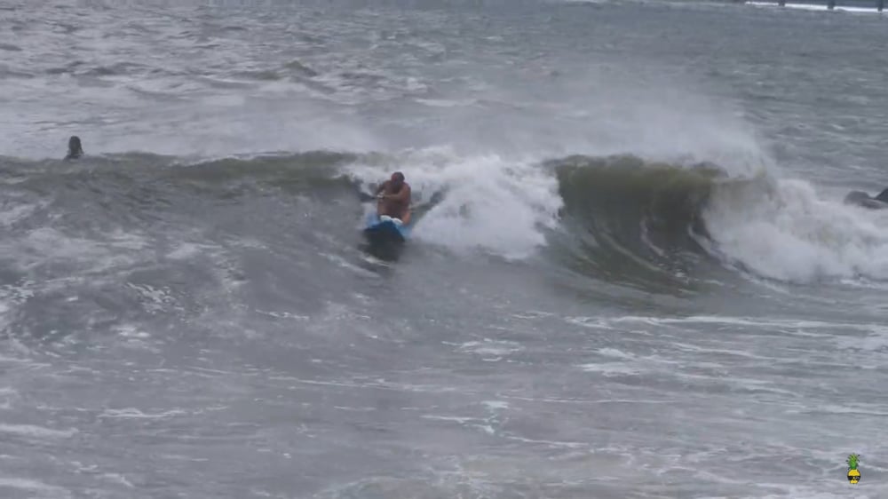 Goat boating on a surf kayak while wavesking