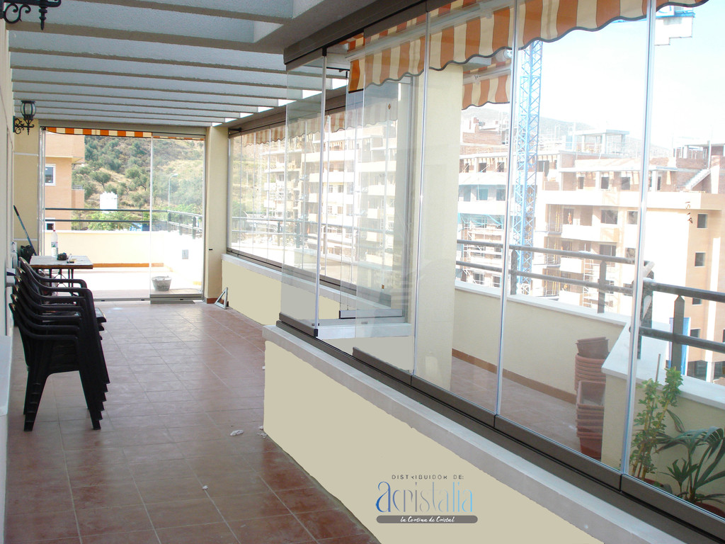 Cortina de vidrio en terraza
