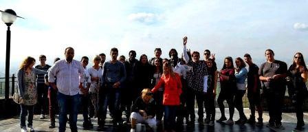Participants next to the Perama cave
