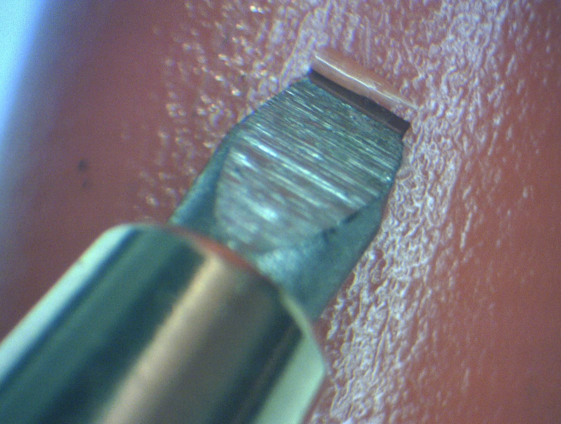 Close-up of flat scraper blade