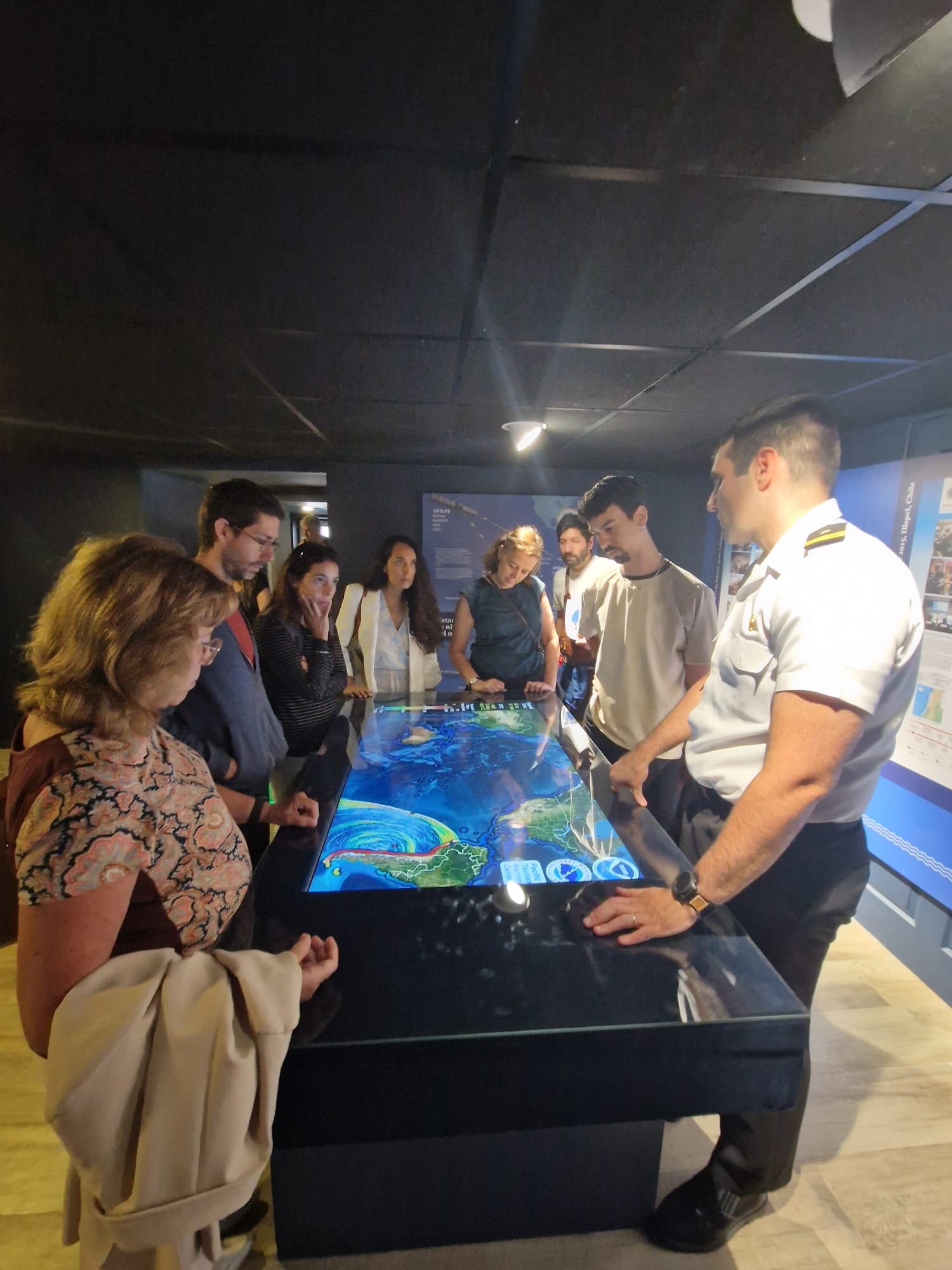 Participants looking at the tsunami simulation map