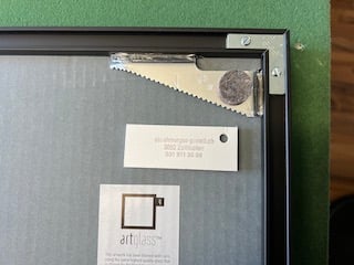 Aluminum frame with picture hanger