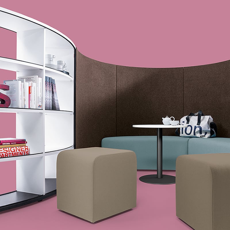 The "sit" seating elements and the "coffee table" are designed to match the shelving system.