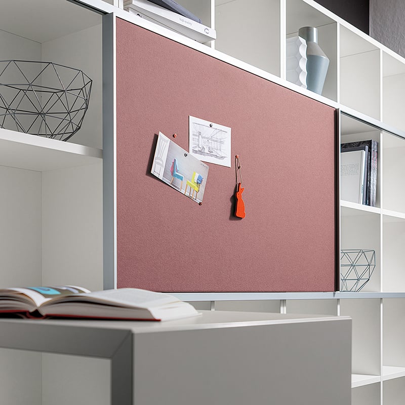Fabric-covered and pinnable sliding doors can be added to the "basic S" shelving system.