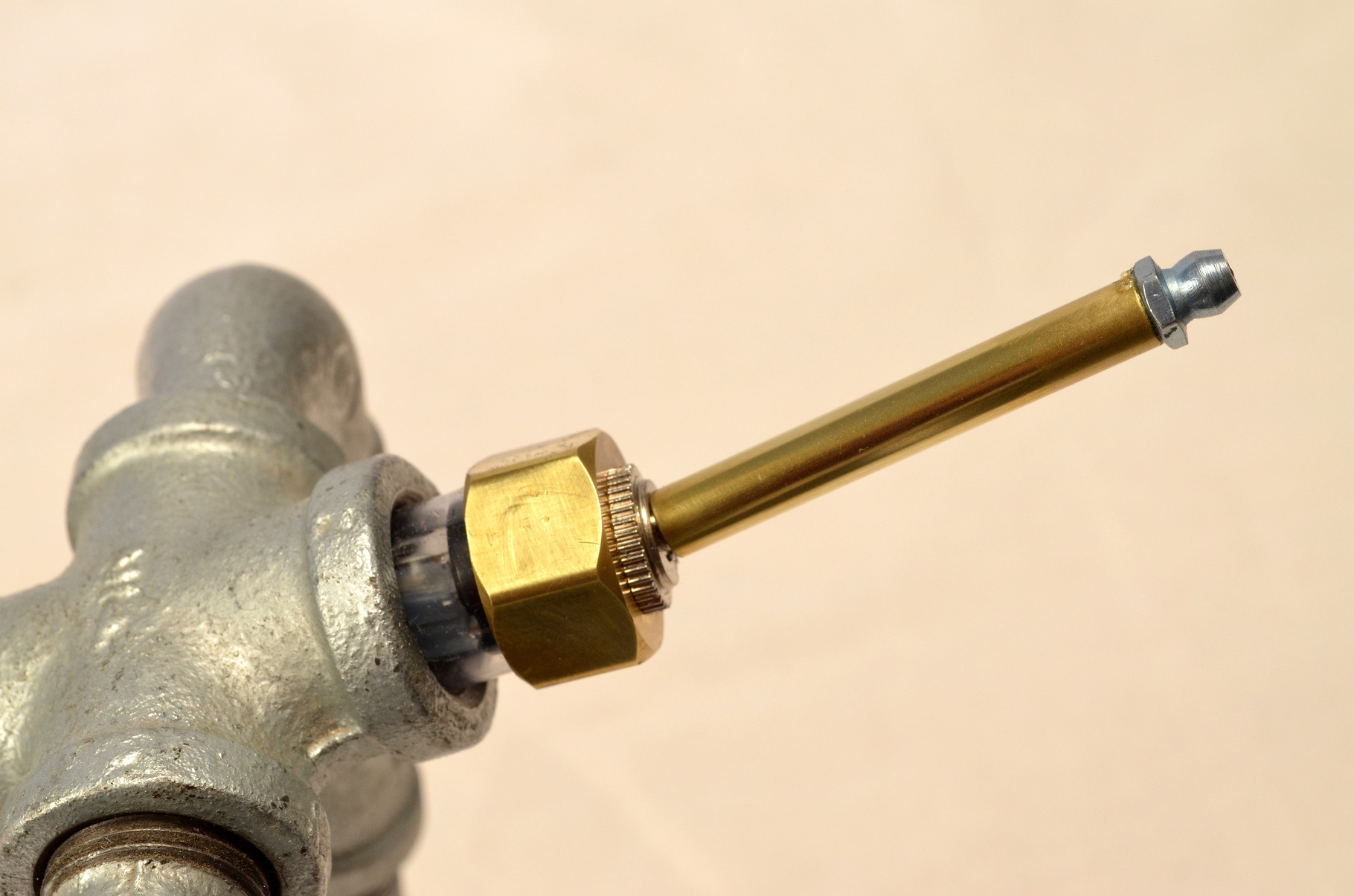 His brass tail doubles as his on/off switch!