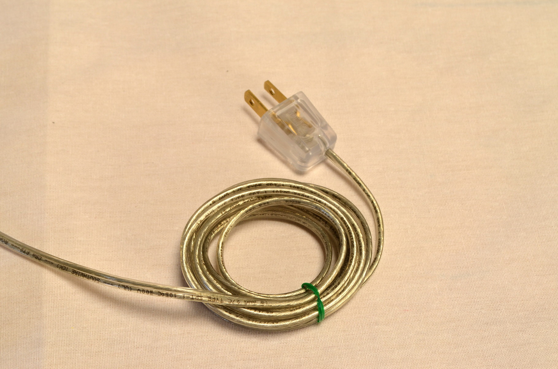 He's wired with an 8 foot heavy duty clear electrical cord with contemporary clear plug.