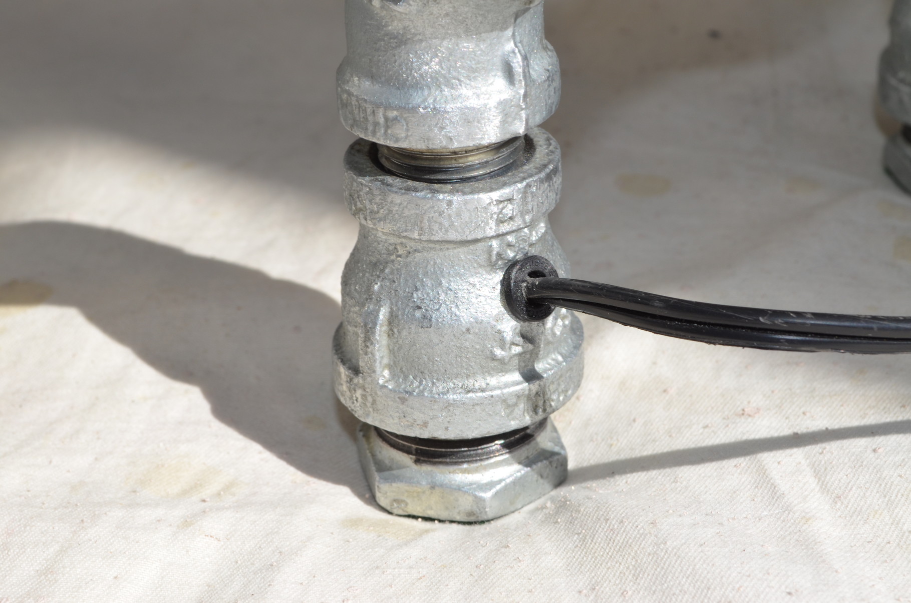 Sophisticated and safe cord exit from rear foot