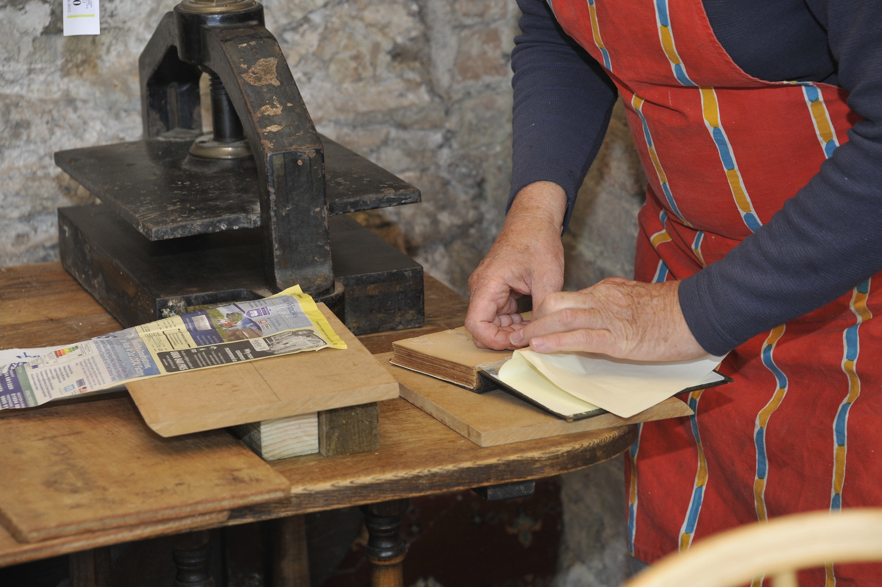 Members of the bookbinding team lovingly restore worse-for-wear books at our very own bindery...