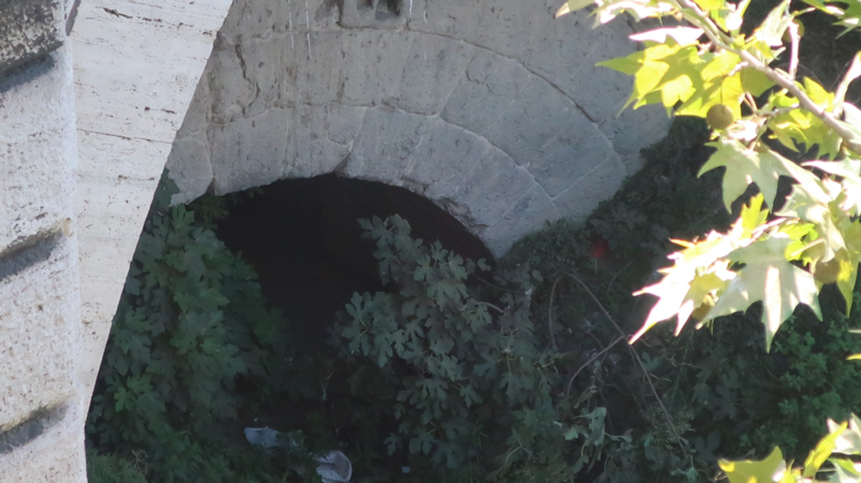 The Cloaca Maxima flowing into the Tiber River