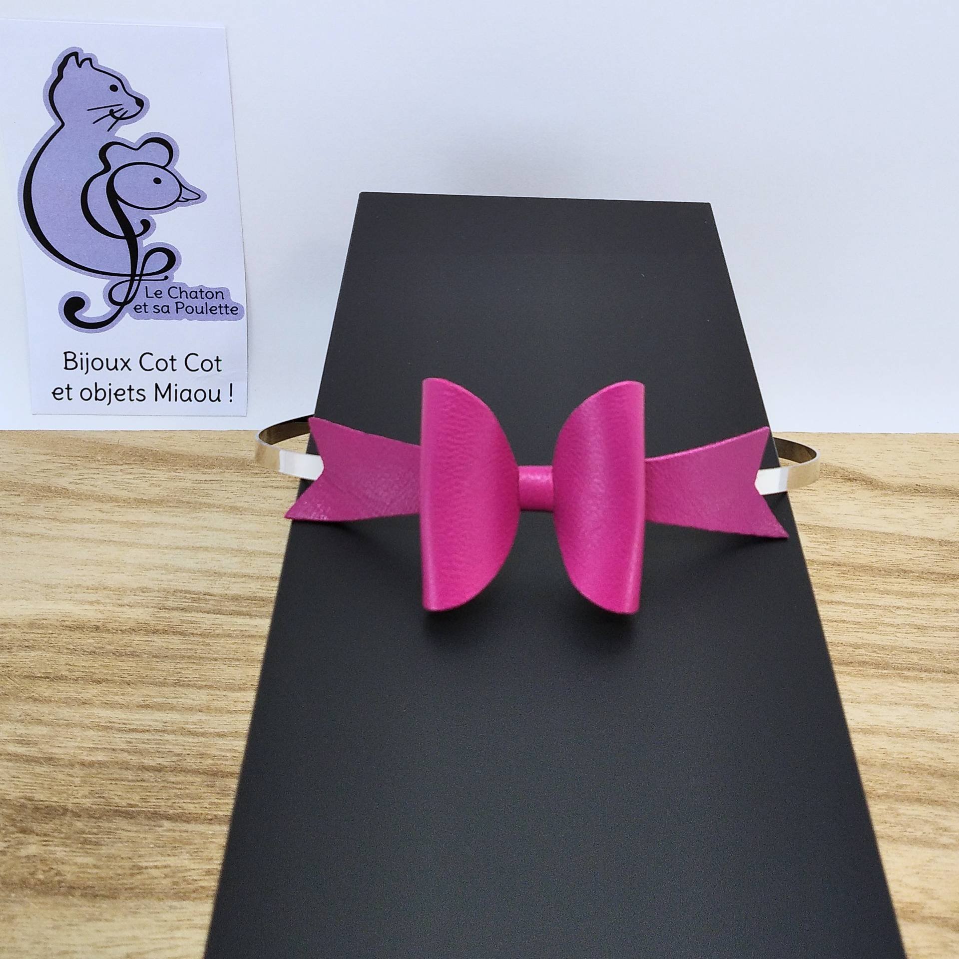 Serre-tête nœud en cuir fuchsia