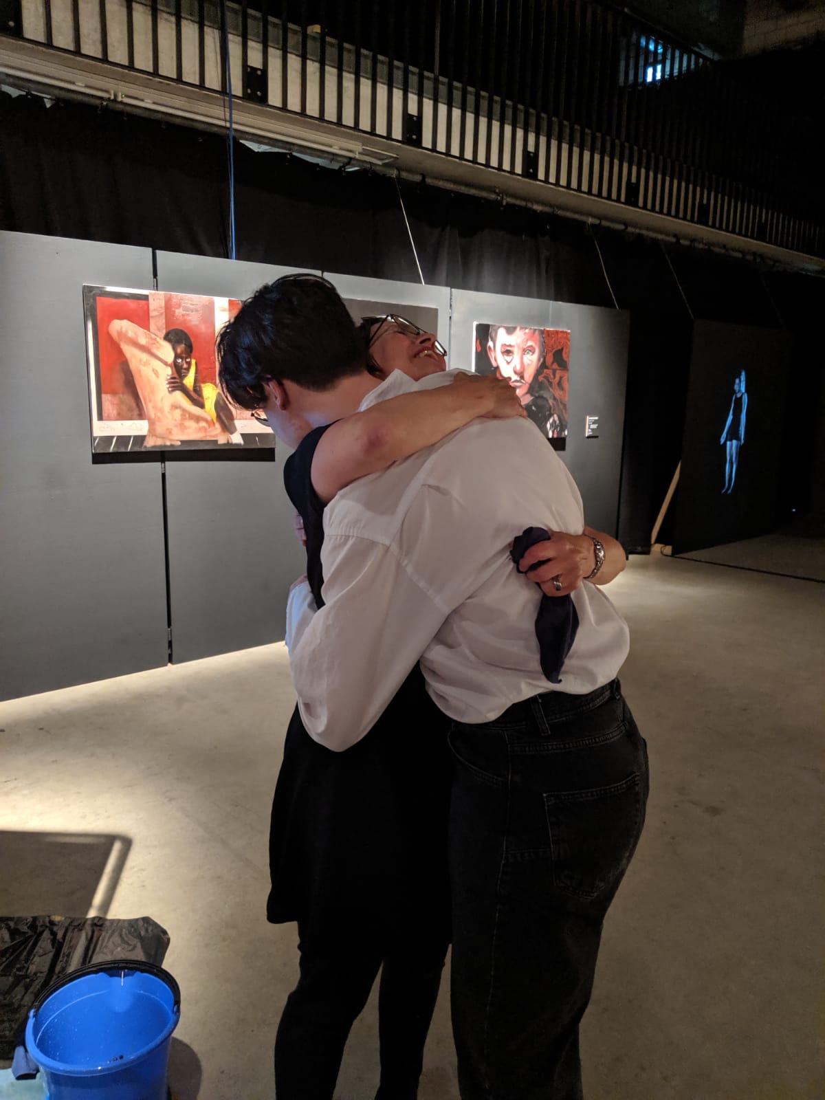 Marianne Iten Thürig "destroying" the poster Salome II of the artist Denys Shantar.