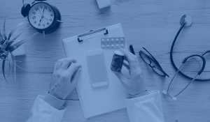 A view of a doctor's desk with medical instruments and medicine.