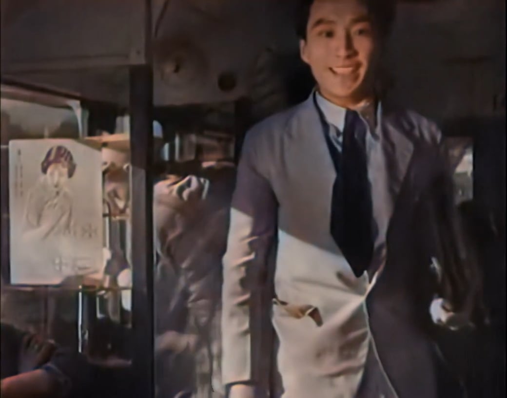 Scene from the movie "New Woman" with the Bayer Aspirin poster of Ruan Lingyu prominently positioned in the screen