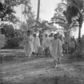Mahatma Gandhi on his peace march in Noakhali (West Bengal), 1946; right of Gandhi: his granddaughter Manu Gandhi.