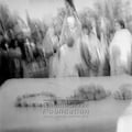 Mahatma Gandhi during his peace march in Noakhali (West Bengal) at a grave yard, c. November 1946; right: Abha Gandhi.