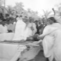Manu and Mahatma Gandhi interact at Noakhali, c. November 1946.