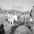 Mahatma Gandhi and party during his visit to the riot-stricken areas in Noakhali, January 1947. Also be seen: Jivan Singh (with turban; member of Indian National Army).
