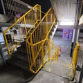 Professional electrostatic spray painting of handrails for staircase in carpark at Camperdown Sydney by Alpha Coatings