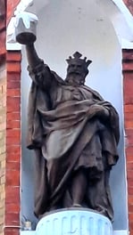 Statue of a king holding a foaming mug of beer at Aldaris brewery in Riga