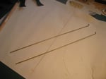 Two bicycle spokes to use as operating rods.
