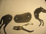 Using hole puncher make holes in puppet for joints.
