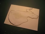 Stick cow's head onto card and draw around it with a pencil.