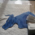 Oiling the head using tissue paper.