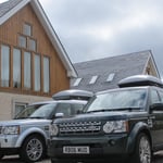 the cars in front of the house