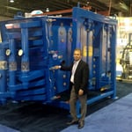 A.J. DeCenso stands with a SWECO BigMax sifter, the largest such machine ever displayed at the Powder Show.