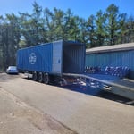 The used and news tires go into containers which we bring to the port.