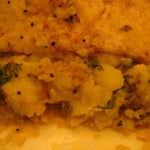 Le plat d'Audrey: une galette de pain avec des patates écrasées et épicées dedans