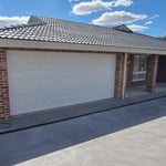 Professional spray painting of garage door for residential property in Penrith by Alpha Coatings