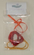 Mixed Christmas Tree Decorations with red tinsel