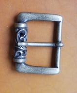 Boucle babylonienne à rouleau vieux laiton