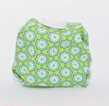 Blumenornamente auf gelbgrün