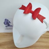 Serre-tête avec décoration nœud en cuir