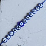 TAYLOR Kit NEVER GROW UP Bracciale Macramé