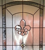 Bathroom stained glass window allows for light and privacy