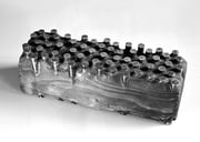 "Face - vestiges (痕跡)  (K-19)"　　　　　 H.8x8x25cm / brass, wood / 1987