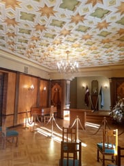Art Deco wood ceiling with carved star decorations in Sigulda New Castle