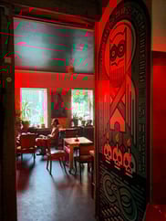 Red-toned interior in Walters & Grapa bar in Riga