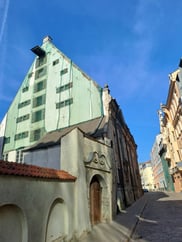 Historic Dannenstern merchants' house in Old Riga with green safety netting