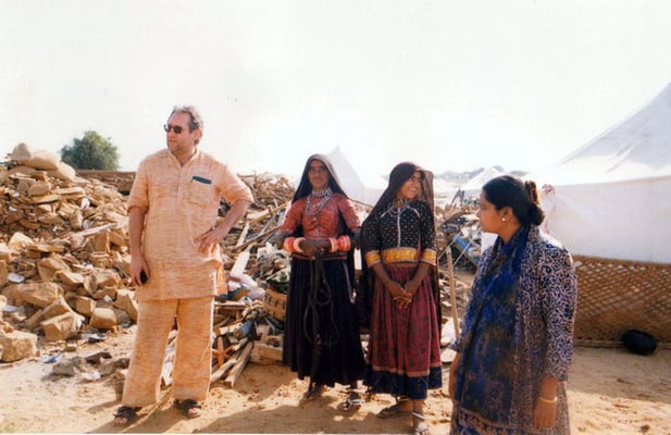 Peter Rühe with surviving women in traditional dresses of the Gujarat Earthquake, 2001