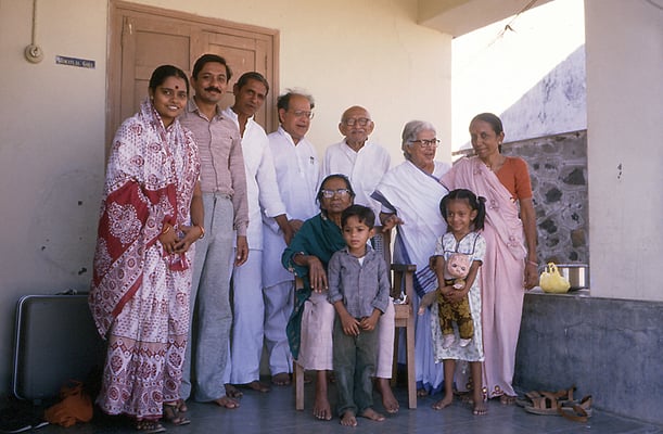 From left: Saroj Goda, Yogesh Goda, Himatlal Goda, Kahandas Gandhi, Prabhudas Gandhi, Nirmala Gandhi, Indira Goda. Front row: Amba Gandhi with Nandan and Shweta Goda, Rashtriyashala, Rajkot, 1986.
