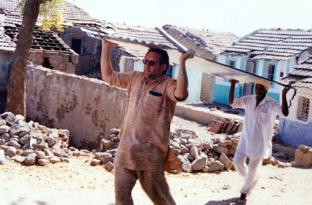 Peter Rühe carries corrugated iron sheets to victims of the Gujarat Earthquake, as part of GandhiServe’s Relief Campaign, Mahendrapur/Gujarat, 2001