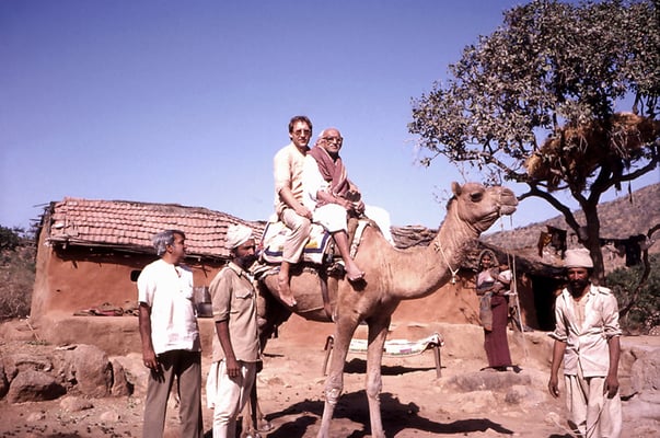 Prabhudas Gandhi and Peter Rühe on camel back visiting the draught-effected Barda Hills near Porbandar, 1987.