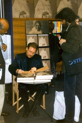Peter Rühe signing his photo biography during Frankfurt Book Fair, 2001. Left: Dr. Joseph Prabhu