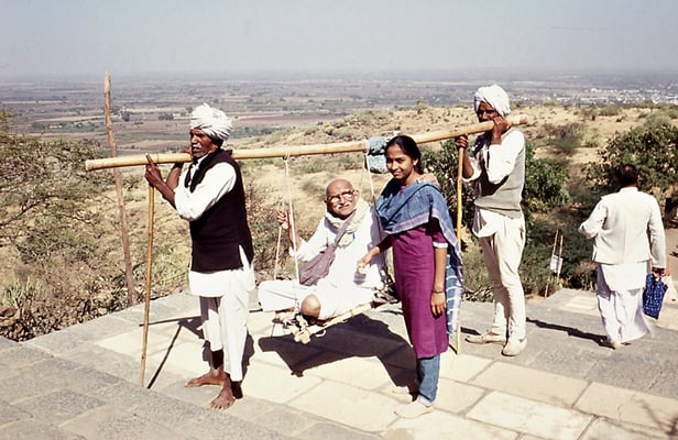 Prabhudas Gandhi getting carried up the mountain Shetrunji near Palitana to visit the jain temples, 1990. Centre: Prabhudas Gandhi's granddaughter Suruchi Deshwal.